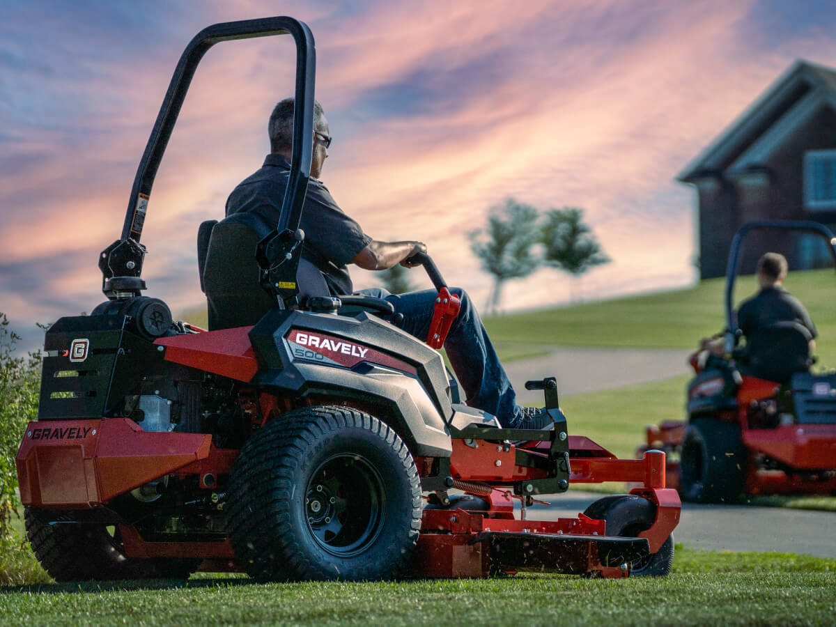 person riding gravely lawn mower