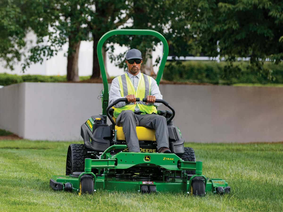 man mowing on z900 john deere
