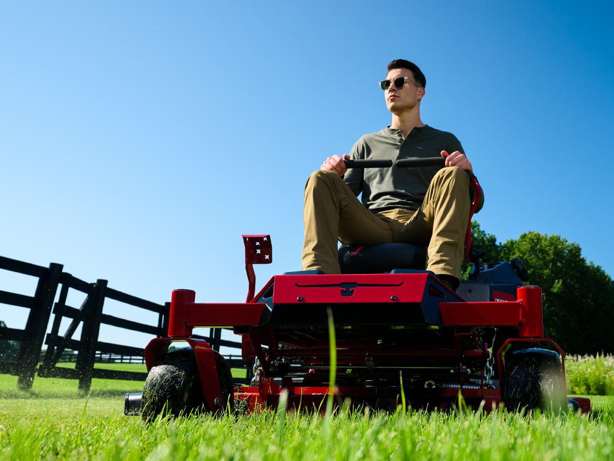 Person riding a toro lawn mower