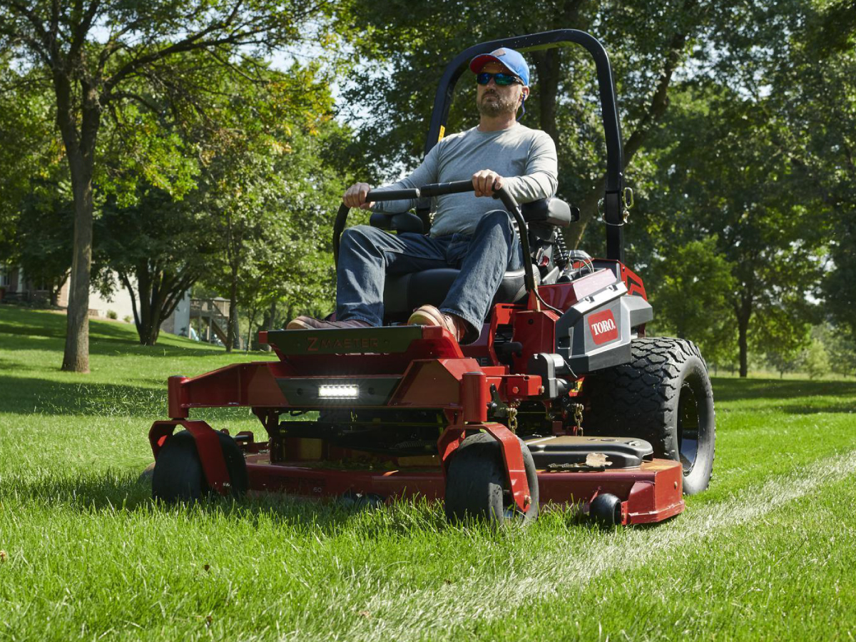 Person on a toro lawn mower