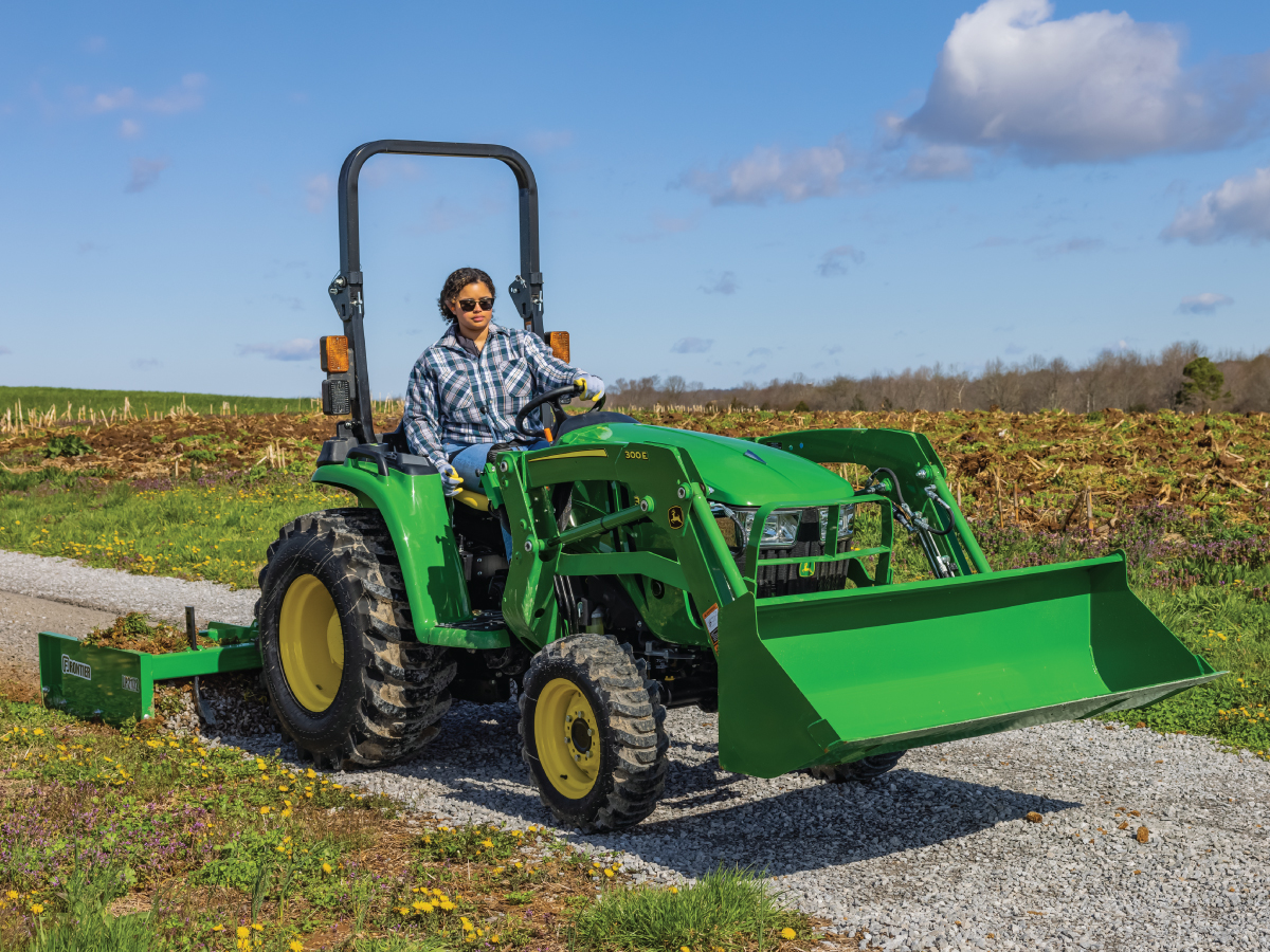 person using 3e john deere tractor